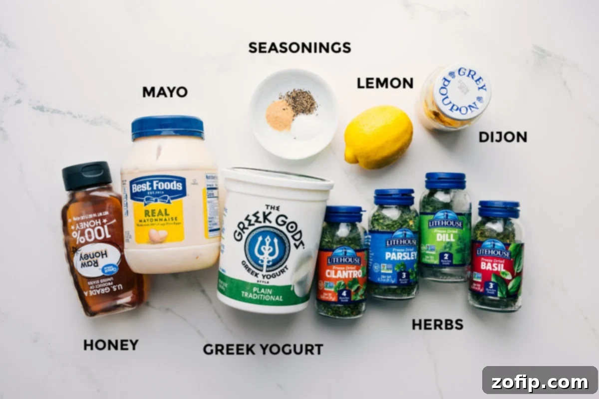 Individual ingredients for Green Goddess dressing, including mayonnaise, Greek yogurt, lemon, Dijon mustard, honey, and a variety of freeze-dried herbs.