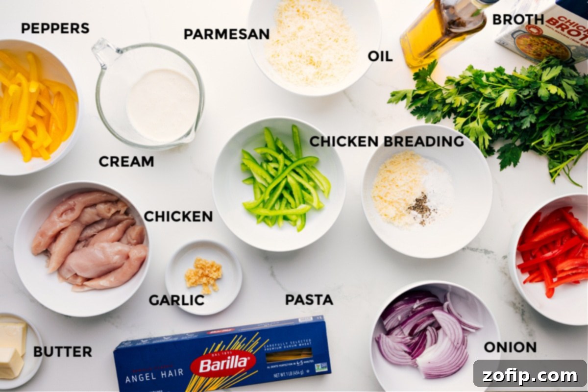 Ingredients In Chicken Scampi All Chicken Scampi ingredients prepped and ready for assembly: bell peppers, heavy cream, chicken cutlets, butter, garlic, pasta, Parmesan cheese, olive oil, red onion, breading, chicken broth, and fresh parsley.