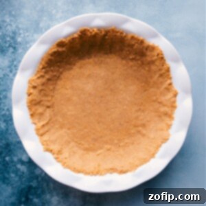 Easy Graham Cracker Pie Crust 3 A beautifully crafted Graham Cracker Pie Crust, golden brown and perfectly set, ready for any delicious filling.