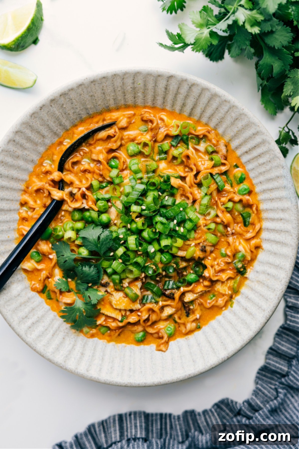 Quick and flavorful Trader Joe’s curry noodle soup recipe with squiggly noodles.