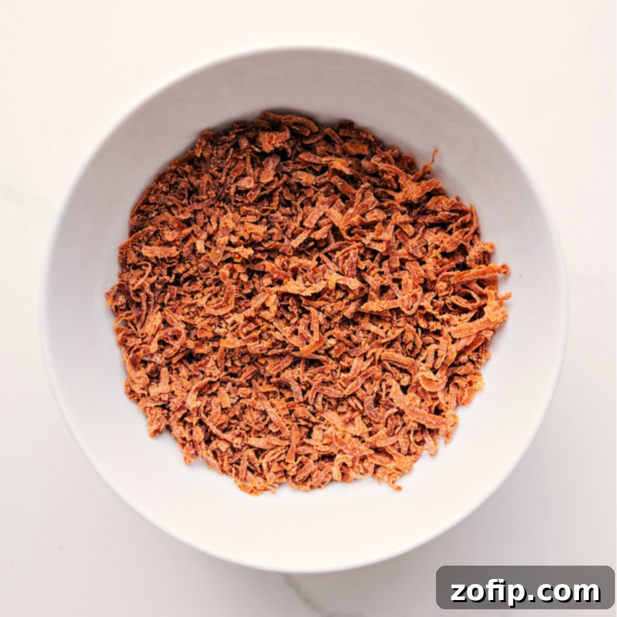 Toasted Coconut To Top Caramel Apple Dessert Cups Toasted coconut prepared to sprinkle on top of this dessert.