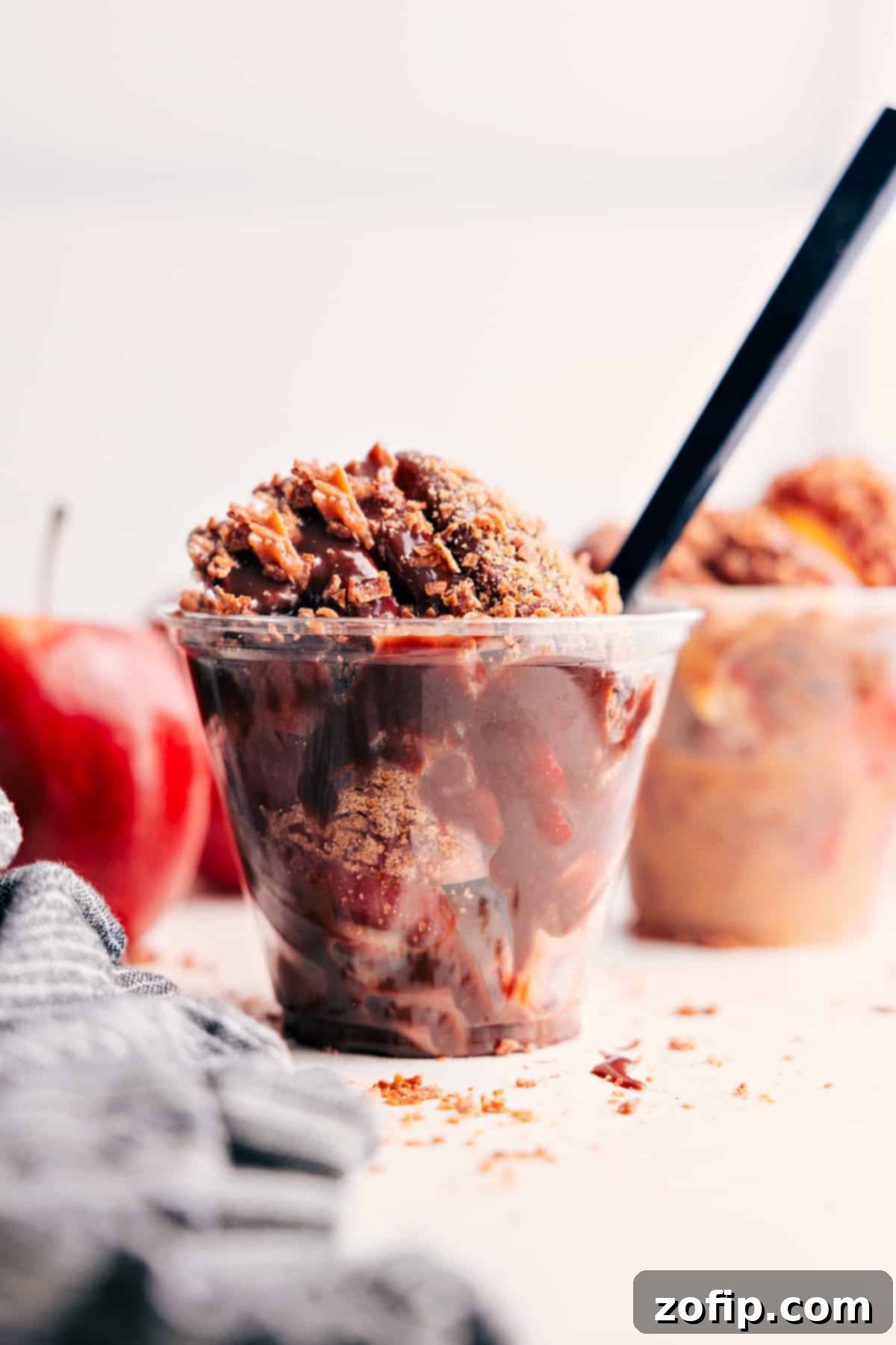 The Ultimate Fall Dessert: Caramel Apple Dessert Cups Caramel Apple Dessert Cups topped with extra chocolate and toasted coconut, ready to serve.