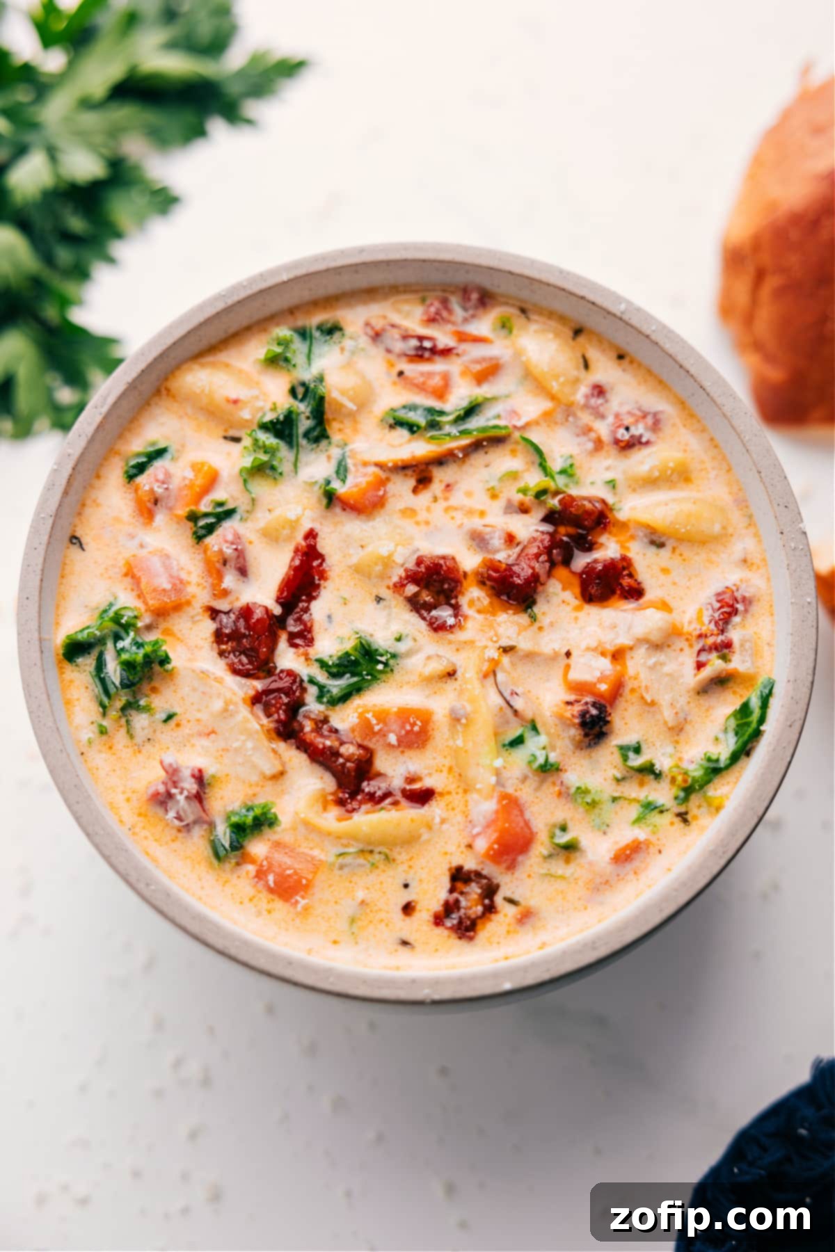 Flavorful And Comforting Marry Me Chicken Soup A steaming bowl of Marry Me Chicken Soup, garnished and ready to be enjoyed, showcasing its rich texture and vibrant ingredients.