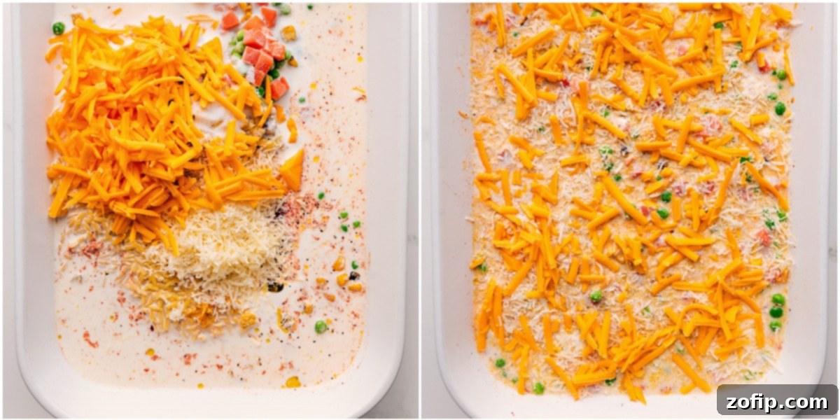 Close-up of the creamy, cheesy chicken orzo bake, showcasing its rich texture and flecks of vibrant vegetables.