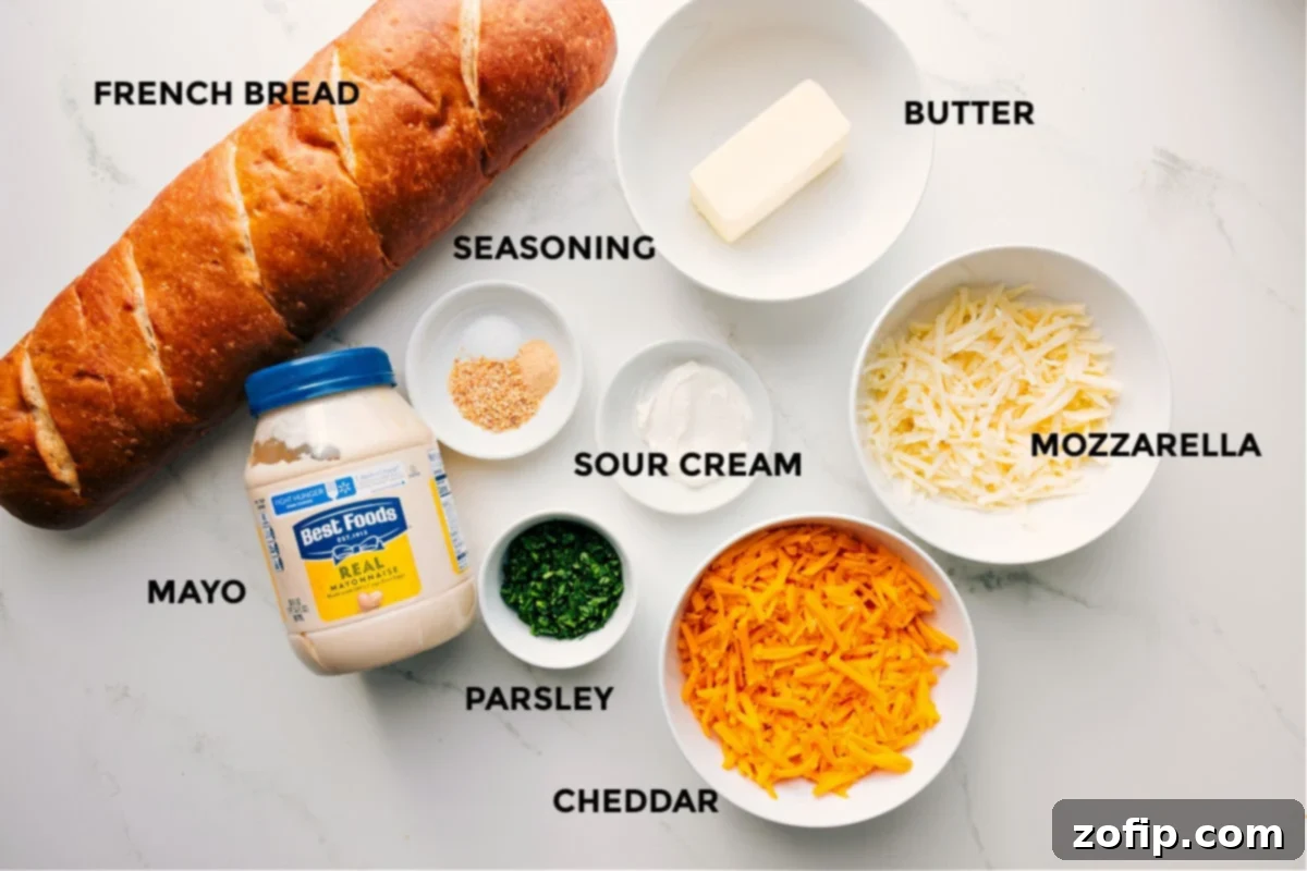 Ingredients In Cheesy Bread Recipe All the essential ingredients for making the ultimate cheesy bread laid out neatly: fresh French bread, mayonnaise, various seasonings, fresh parsley, sour cream, softened butter, and freshly shredded mozzarella and cheddar cheese.
