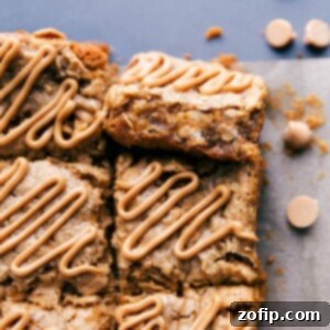 Oatmeal bars with peanut butter glaze on top ready to be enjoyed.