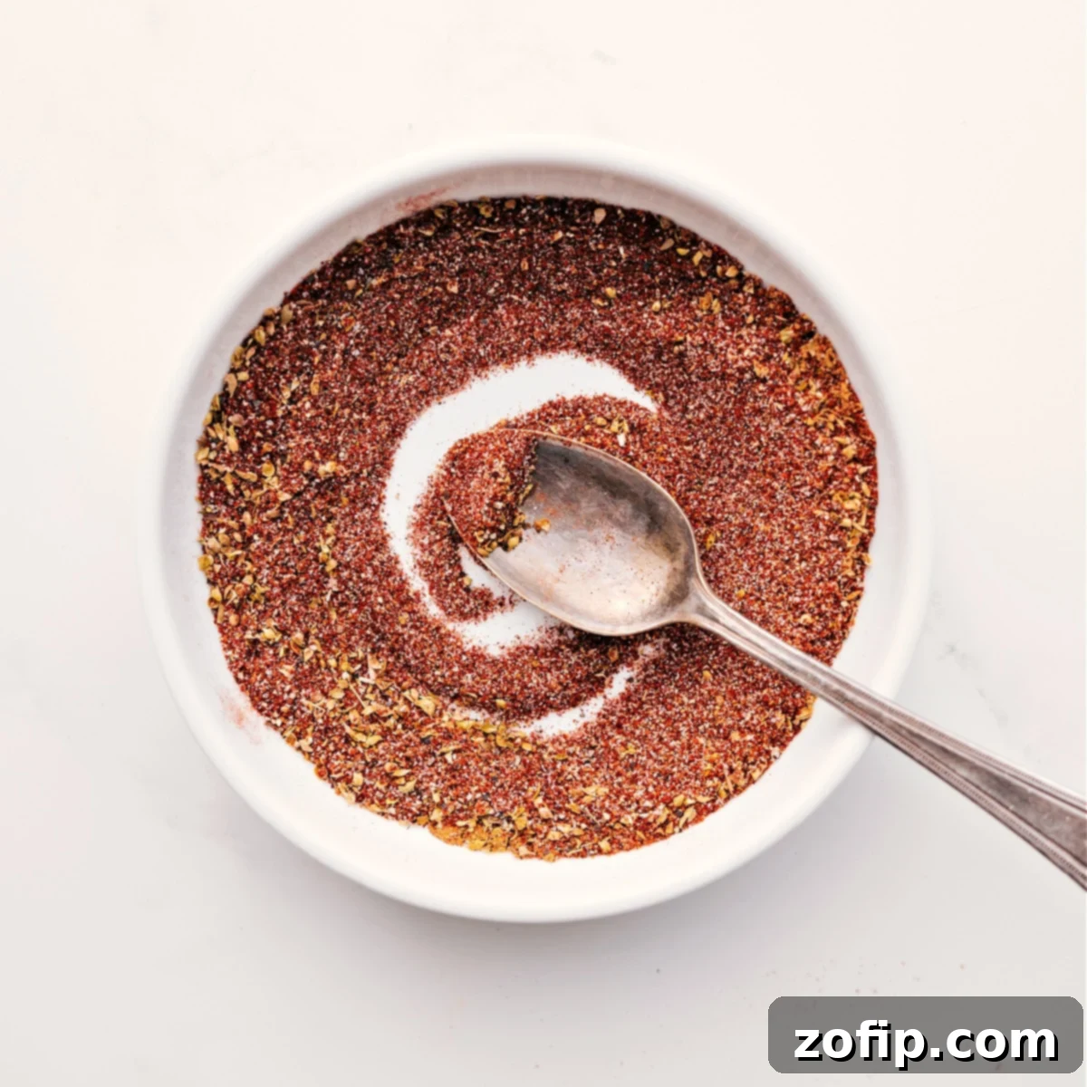 How To Make Homemade Chili Seasoning Recipe All the ingredients for the homemade chili seasoning mixed together in a bowl, showcasing a quick spice blend.