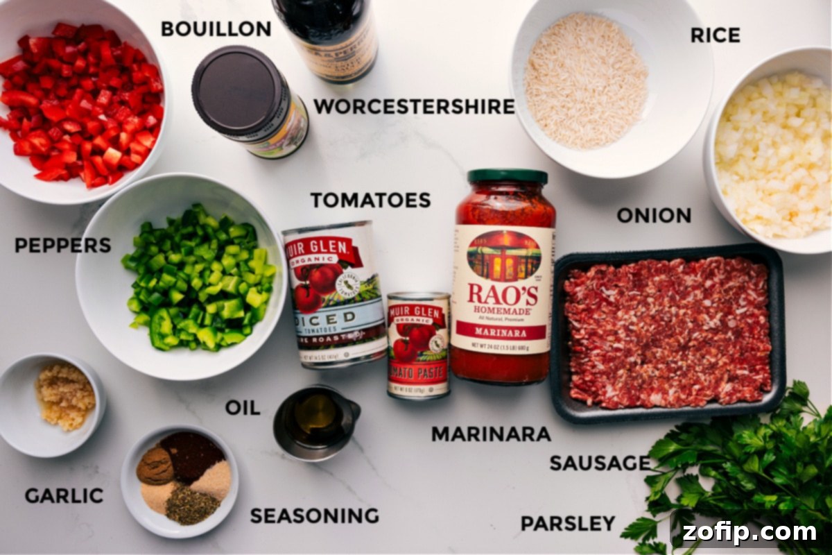 All the fresh ingredients for Crockpot Stuffed Pepper Soup, including vibrant bell peppers, onions, garlic, ground Italian sausage, canned tomatoes, various spices, and fresh parsley, neatly prepped on a wooden board.