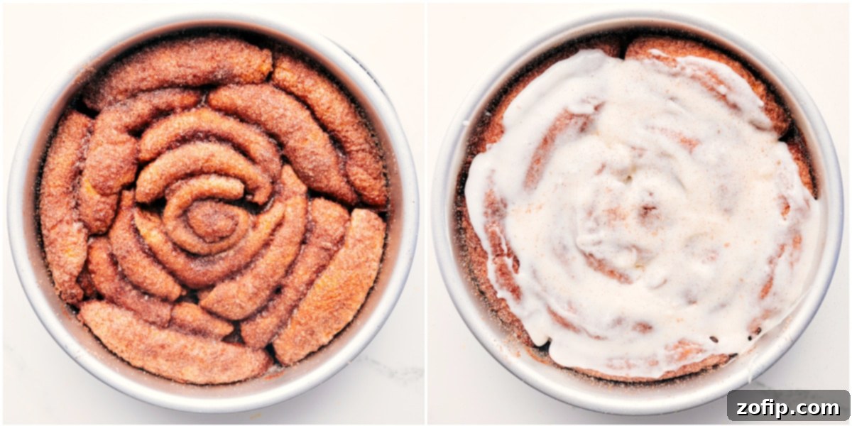 A freshly baked Cinnamon Roll Cake, golden brown and still warm in its pan, generously topped with a luscious, smooth cream cheese frosting, ready for serving.