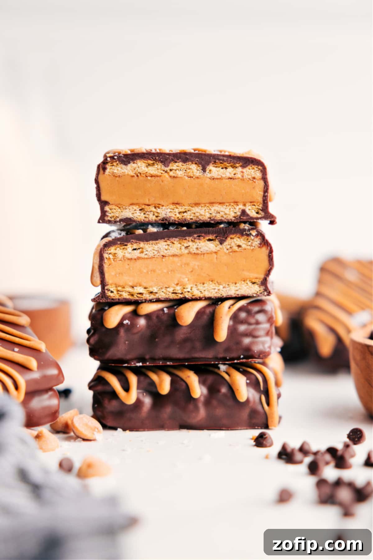 Stack of Buckeye Graham Crackers with one broken open showing creamy peanut butter filling.
