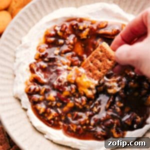 A top-down view of the completed Pecan Pie Dip, garnished with extra pecans, ready for serving.