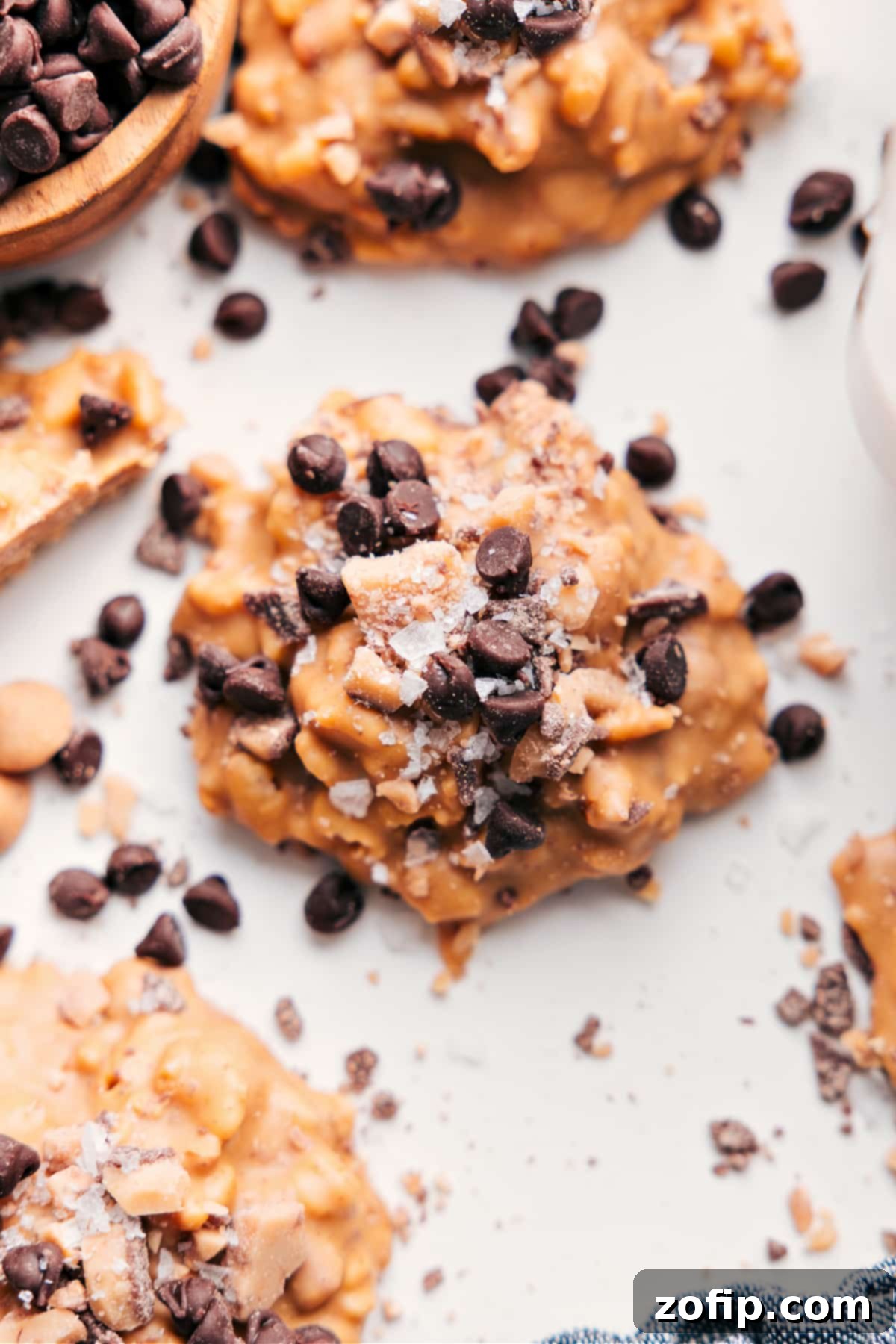 White Chocolate Pretzel Clusters with added mini chocolate chips and flaky sea salt on top, showcasing their irresistible sweet-salty crunch.