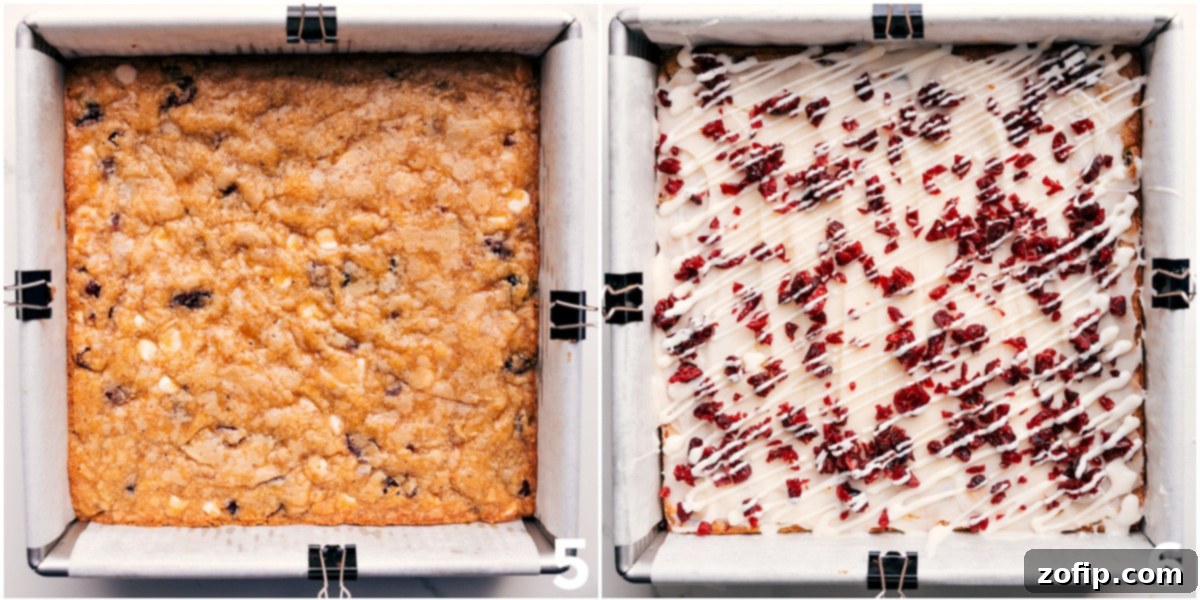 The baked bars out of the oven with the white chocolate topping and fresh chopped cranberries on top.