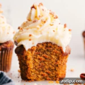 Finished Carrot Cake Cupcakes with cream cheese frosting and pecans