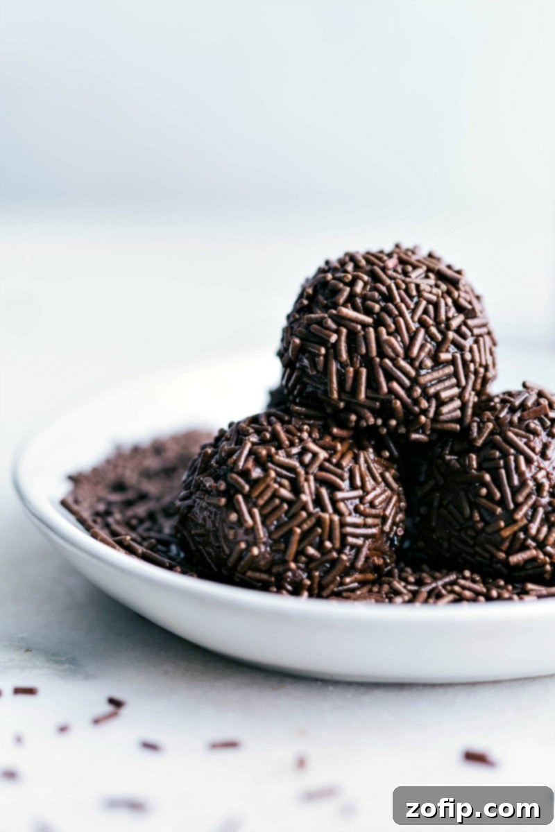 Ultra-chocolatey and fudgy Brigadeiros, a classic Brazilian treat. Ready-to-eat chocolate sprinkle-covered Brigadeiros, perfectly round and rich.