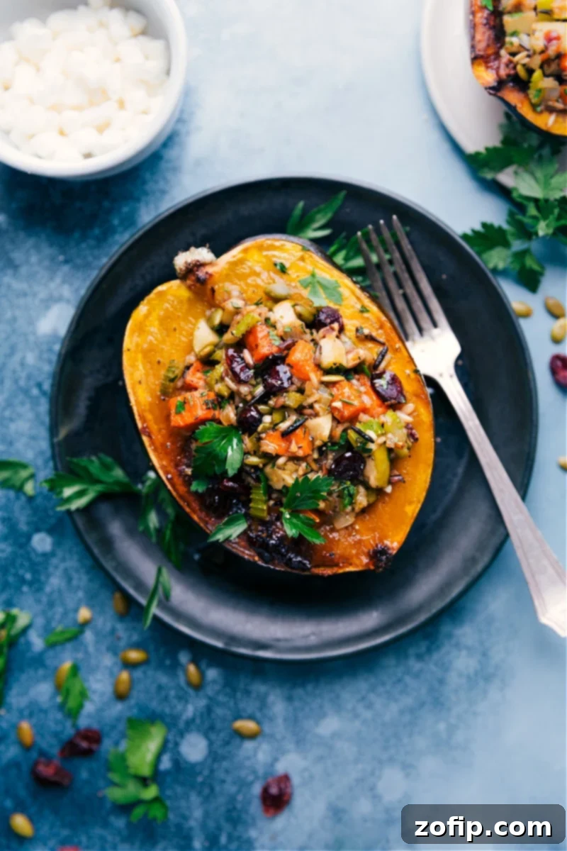 Stuffed Acorn Squash, perfectly roasted and filled with wild rice, sweet potato, and apple.
