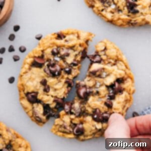 Easy Small Batch Oatmeal Cookies 2 The small batch of chocolate chip cookies with one cookie broken open.