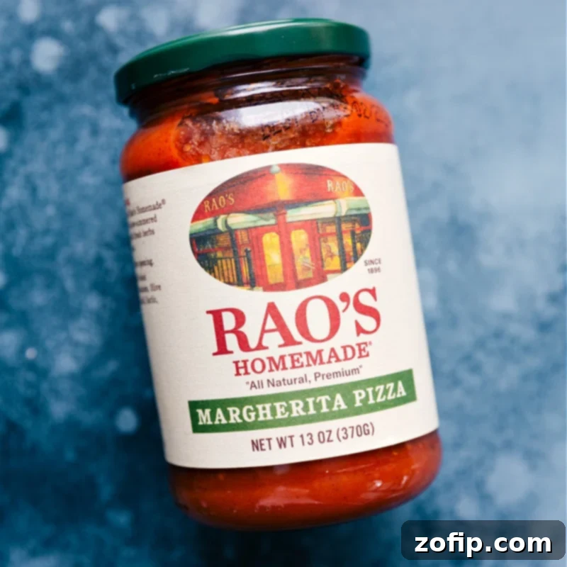 A bowl of rich red pizza sauce, ready to be spread onto the flatbread crust.