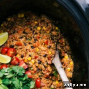 Tex mex quinoa in crockpot full of flavor with fresh vegetables and cilantro.