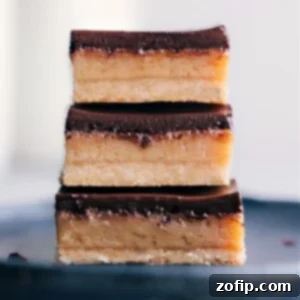 Twix Two Finger Treat 2 Delicious homemade Twix Bar, showcasing its perfect layers of shortbread, caramel, and chocolate