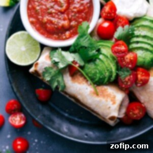 Power Burrito 4 Healthy burritos topped with fresh vegetables, ready to be enjoyed.