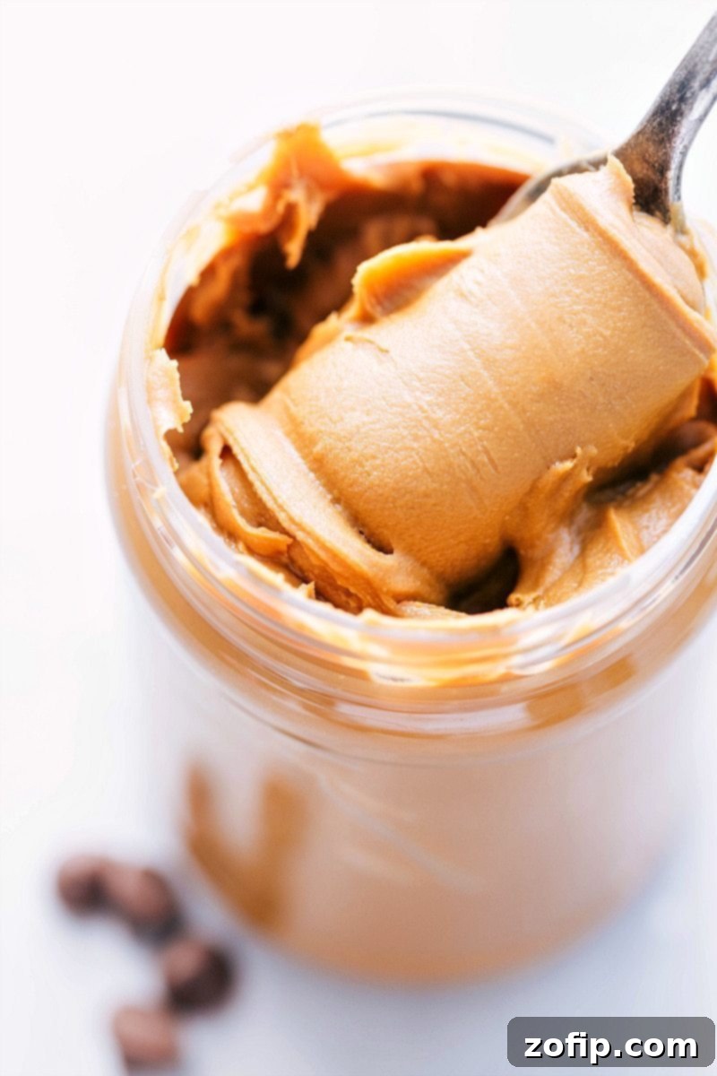 A close-up of a perfectly formed homemade Cookie Butter Cup with a smooth chocolate top, ready to be enjoyed as a simple, delicious no-bake snack.