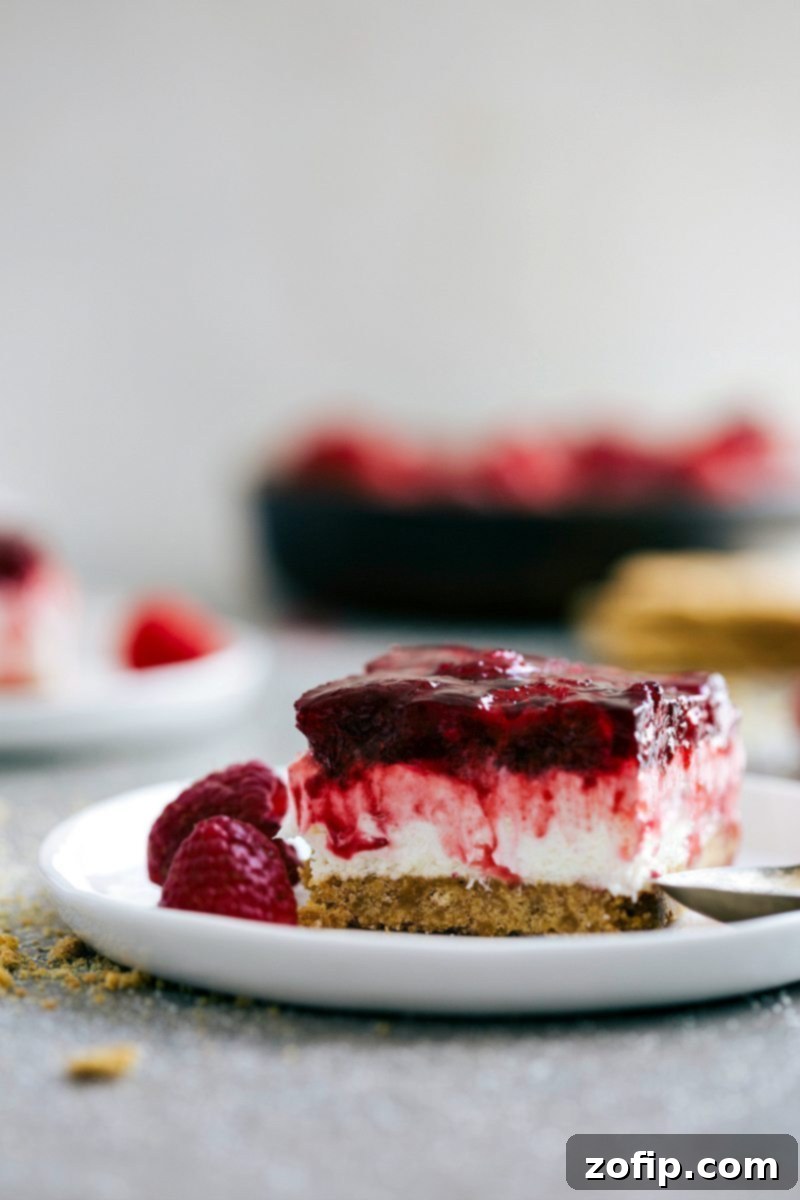 An inviting image of a fully set Raspberry Jello Dessert, ready to be served and enjoyed.