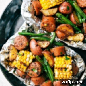 Foil Pack Garlic Butter Sausage & Veggies cooked and ready to serve.