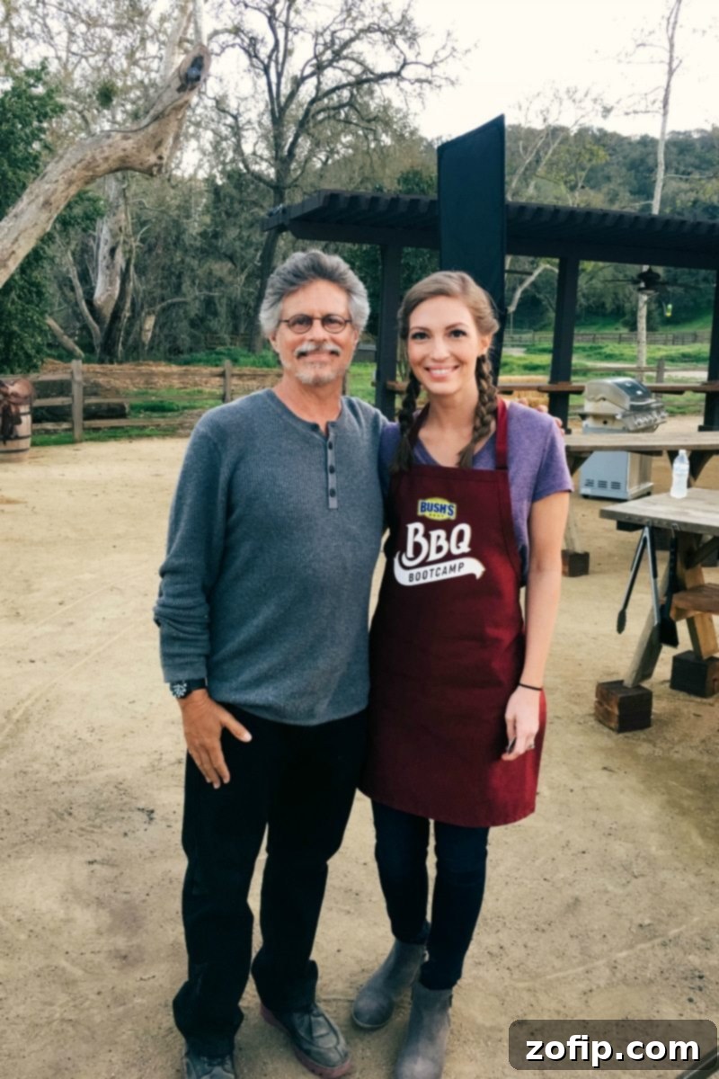 A stack of two perfectly grilled hamburgers with melted cheese and fresh toppings on toasted brioche buns, ready to be enjoyed.