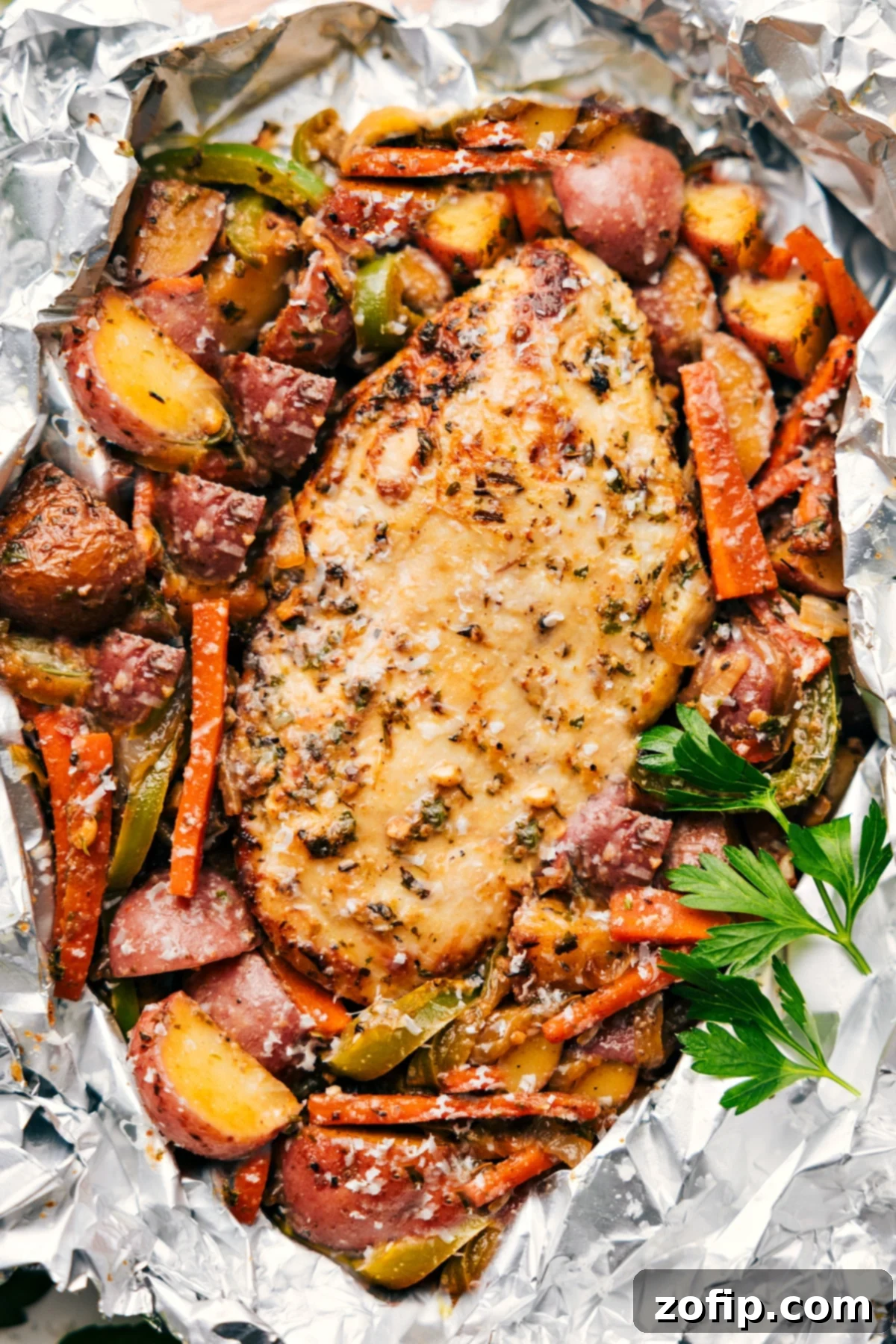 Quick And Easy Foil Pack Italian Chicken And Veggies Dinner Foil Pack Italian Chicken and Veggies fresh out of the oven ready to be enjoyed.