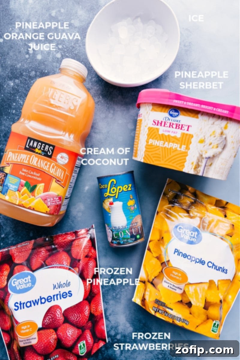 Essential ingredients for a perfect Strawberry Piña Colada smoothie: fresh and frozen fruits, cream of coconut, and juice. A vibrant flat lay showing all the fresh and frozen ingredients laid out for making the Strawberry Piña Colada smoothie, including pineapple, strawberries, cream of coconut, juice, sherbet, and ice.