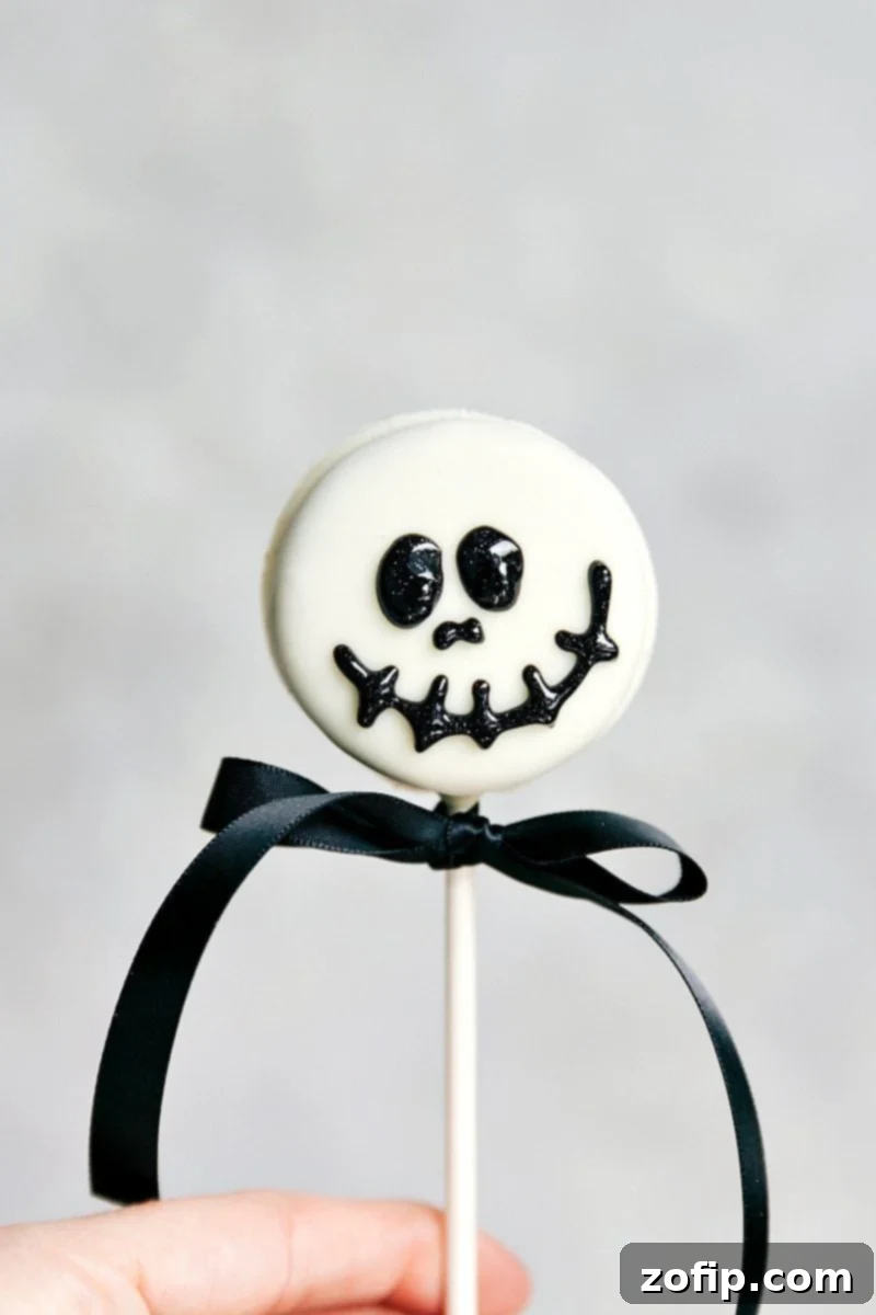 SKELETON OREO POP! Simple Halloween Oreo Pops -- Spider Oreo Pops, Skeleton Oreo Pops, Frankenstein Oreo Pops, and Monster Oreo Pops are fantastic for any festive spooky event. via chelseasmessyapron.com