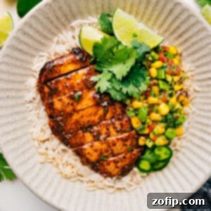 A delicious grilled taco chicken with avocado corn salsa, perfect for a summer recipe.