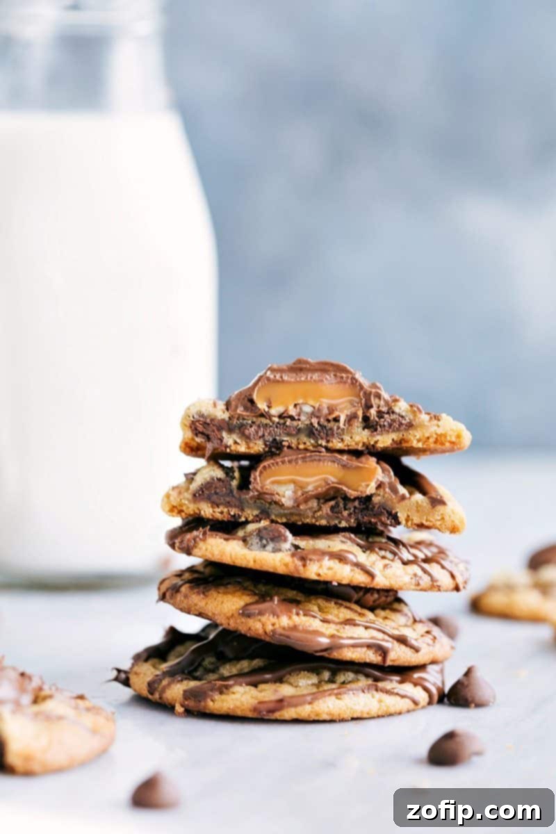 Close-up of decadent Chocolate Drizzled Turtle Cookies, topped with pecan caramel turtles and a rich chocolate drizzle, on a white background.