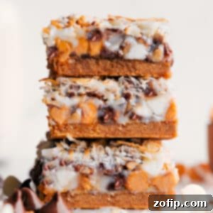 Magic Bars Recipe 2 A close-up of a single 7 Layer Bar, showcasing its rich, gooey layers and golden brown edges.
