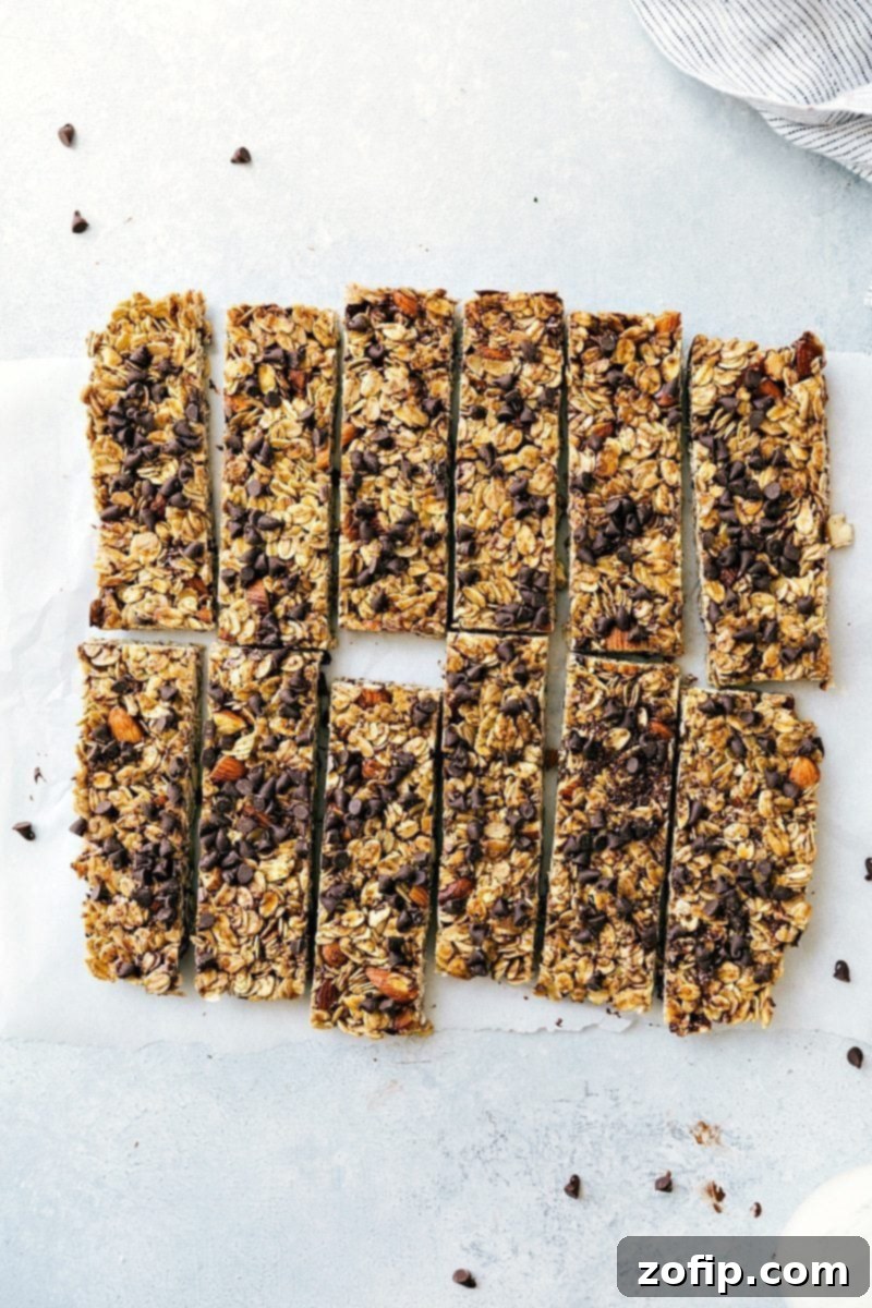 Delicious homemade granola bars, full of chocolate chips, cut into portions, and ready to be enjoyed.