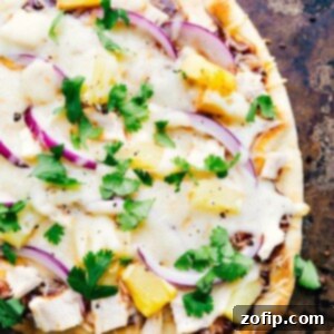 Hot and fresh BBQ Chicken Flatbread with pineapple and red onion, ready to eat