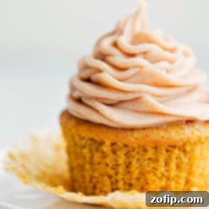 Ready to eat delicious pumpkin cupcake with a cinnamon cream cheese frosting.