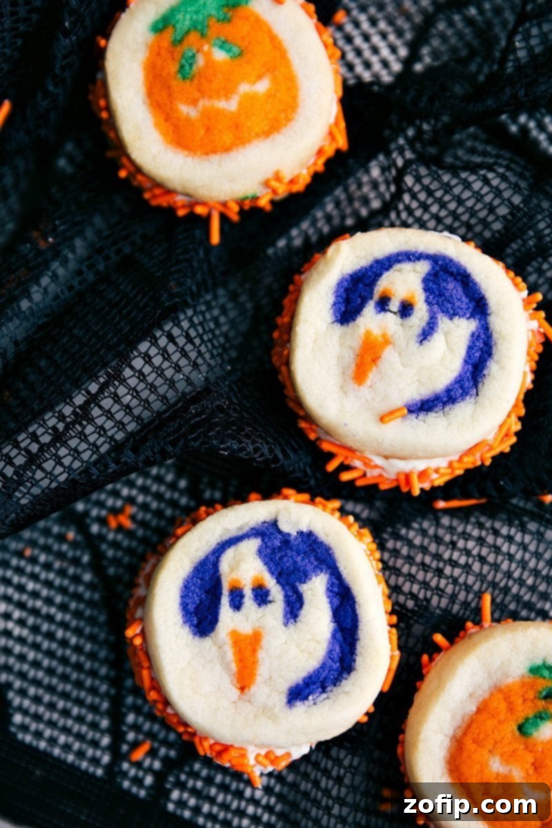 Double-Sided Halloween Cookies - Fun & Easy Recipes Four double-sided Halloween sandwich cookies, featuring pumpkin and ghost designs.