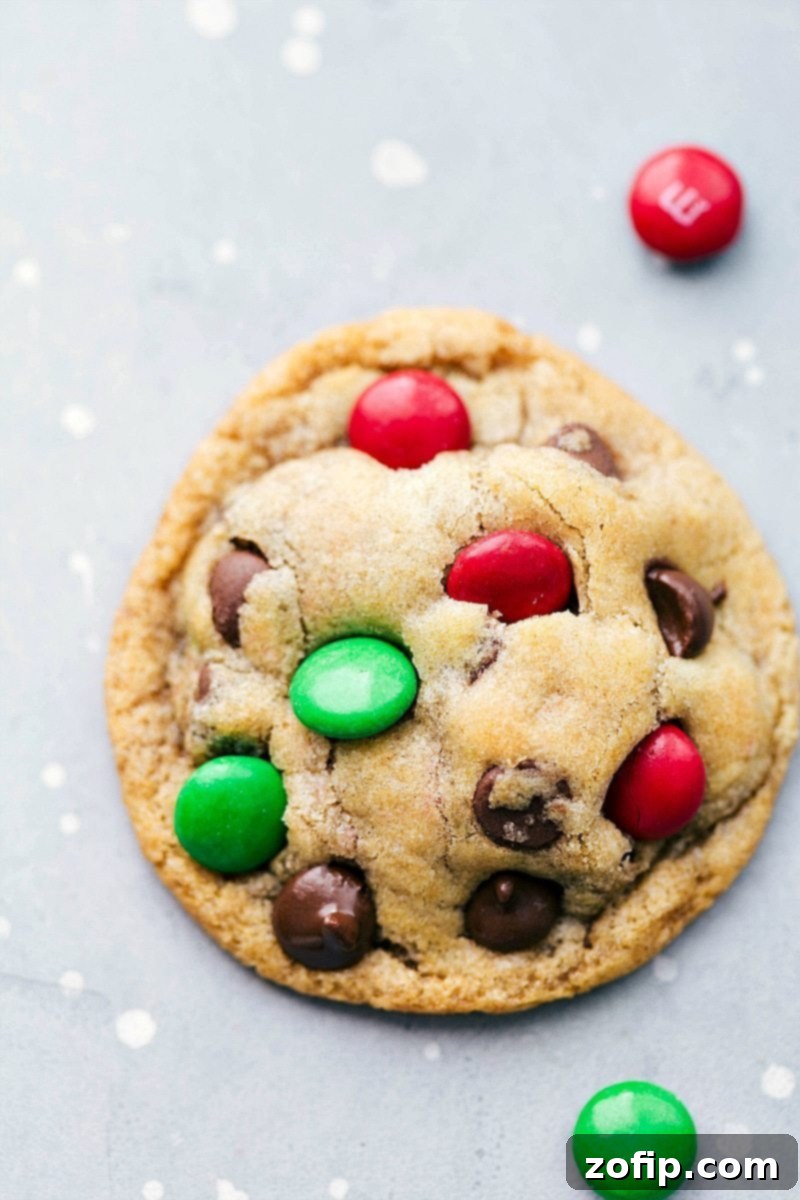 Mason Jar M&M Cookie The Perfect Holiday Treat Recipe Freshly baked M&M Mason Jar cookies on a cooling rack, showcasing their vibrant colors and soft texture.
