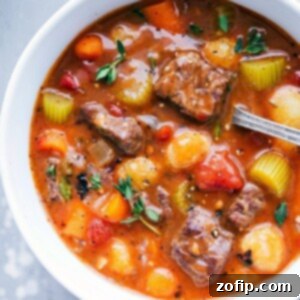 Melt In Your Mouth Slow Cooker Beef Stew 3 A delicious Crockpot Beef Stew with Gnocchi, presented beautifully in a white bowl.