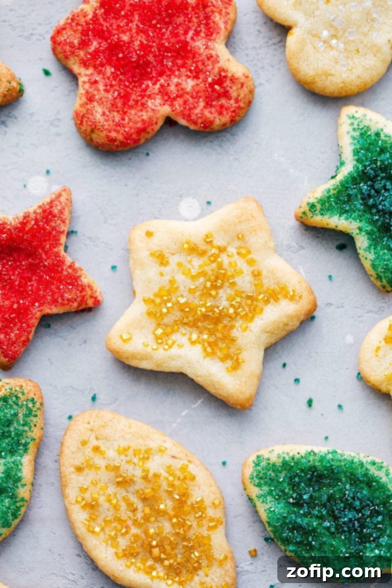 Mason Jar Cookie Delights 3 Close-up of a decorated Mason Jar Sugar Cookie gift, showing ribbon, whisk, and cookie cutter.