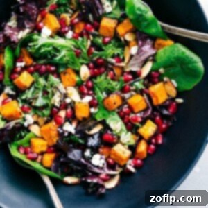 Bowl brimming with vibrant pomegranate salad, a cherished dish on our Thanksgiving dinner menu.