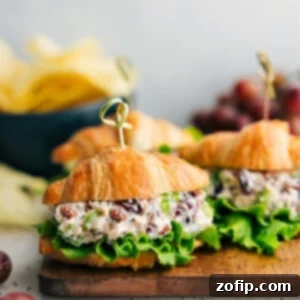 Chicken Salad recipe assembled in a croissant with lettuce.