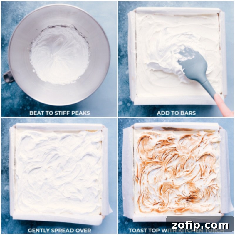 This life changing S'mores Icebox Cake features layers of rich chocolate ganache, fluffy marshmallow cream, and honey graham crackers. No baking required! Recipe via ChelseasMessyApron #dessert #best #quick #easy #simple #treat #chocolate #marshamallow #grahamcrackers #summer #smores #icebox #cake Process shots of the S'mores Icebox Cake, showing the meringue topping being expertly added to the cake and then toasted to a golden perfection with a kitchen torch.