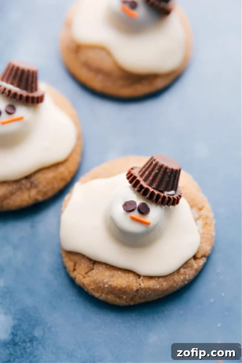 Overhead image of a collection of finished Melted Snowman Cookies arranged on a serving platter, ready for holiday enjoyment.