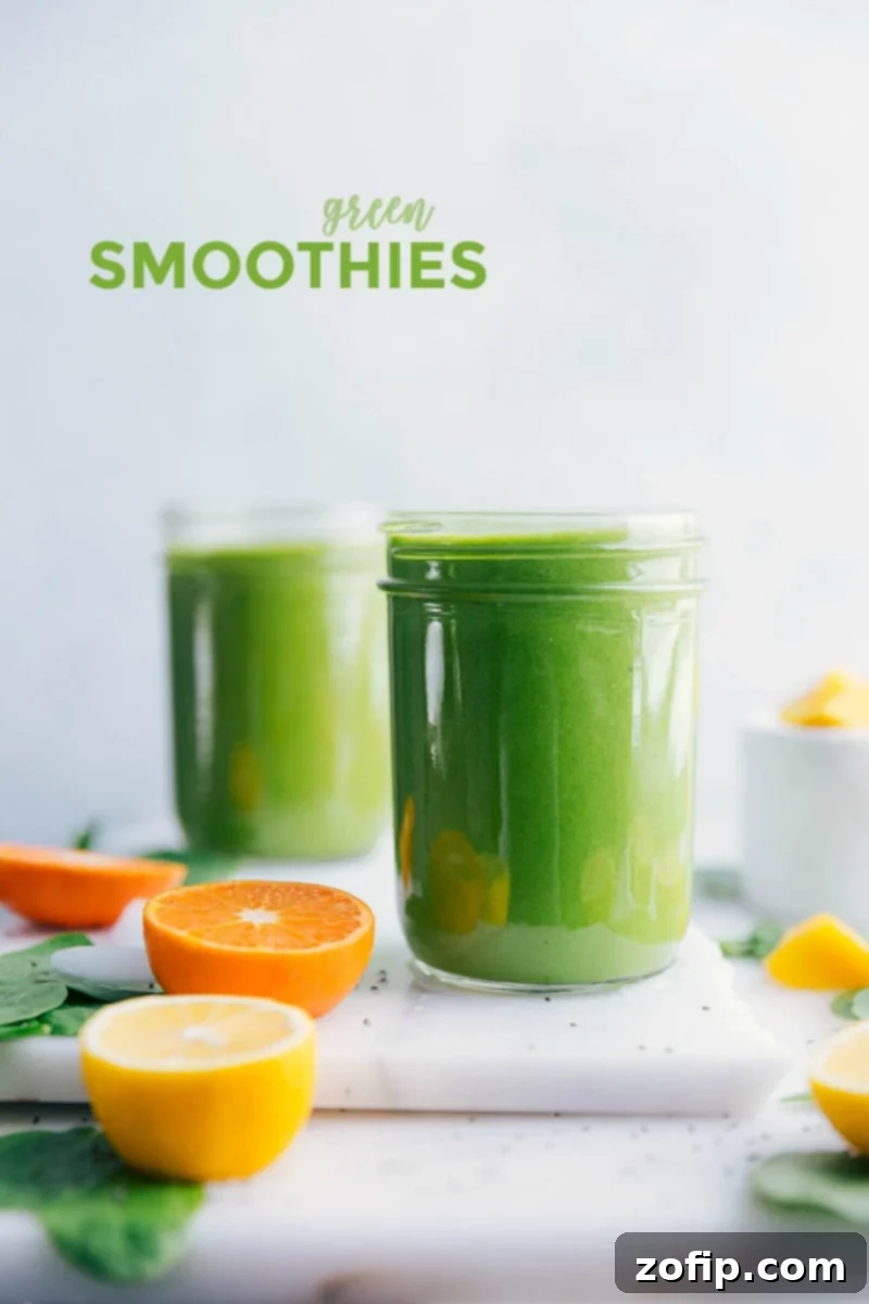 Refreshing Green Smoothie: A healthy and delicious blend for a vibrant start to your day. Vibrant green smoothie glasses on a table, encircled by fresh citrus slices and lush green spinach.