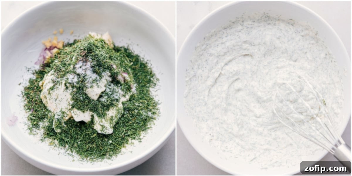 All the fresh ingredients for the homemade veggie dip—sour cream, mayo, ranch seasoning, grated red onion, minced garlic, dill, salt, and pepper—are combined in a glass bowl and being whisked together until smooth and perfectly blended.