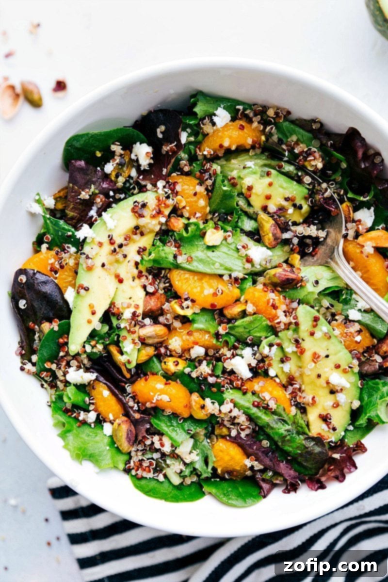 Close-up, top-down view of the prepared Citrus Quinoa Salad, showcasing its readiness to be served with all ingredients beautifully combined.