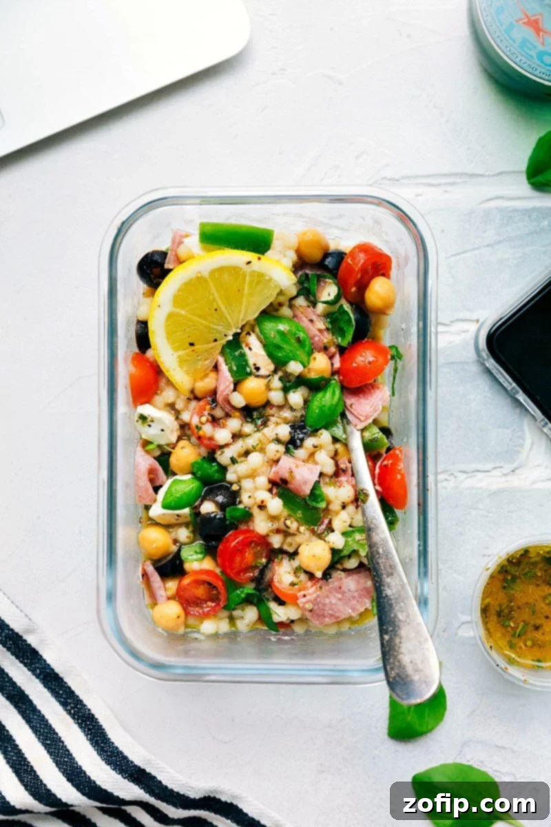 Meal Prep Italian Couscous Salad 8 Several Italian Couscous Salad meal prep containers neatly arranged on a counter, ready for a healthy week of lunches or dinners.